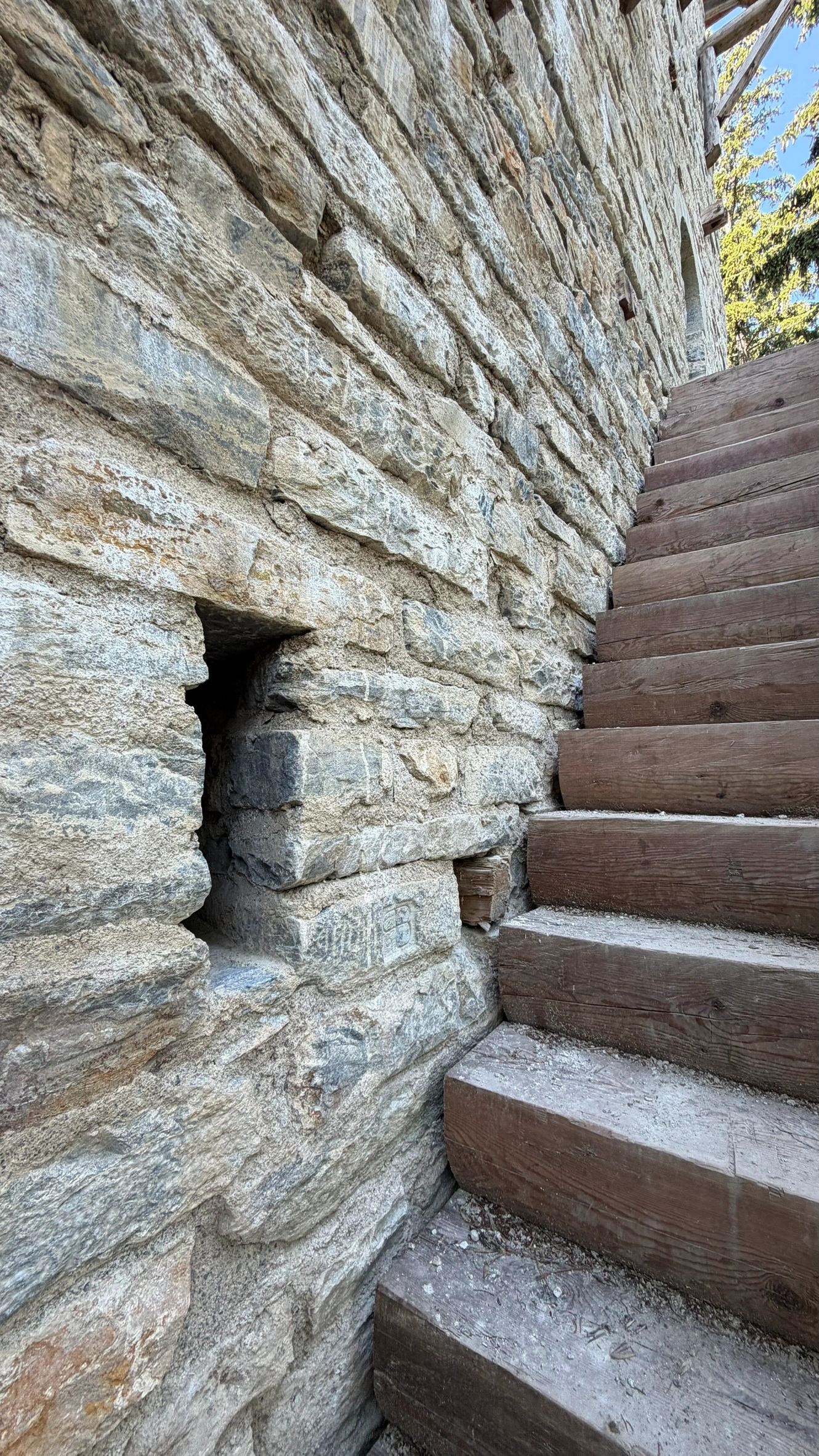 Rectangular opening for light and ventilation beside the entrance staircase.