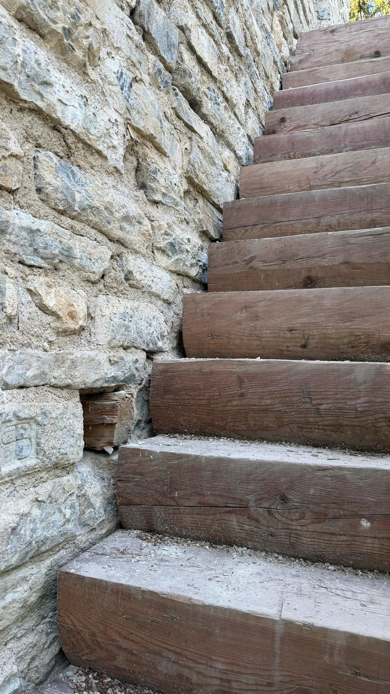 Square opening for light and ventilation beside the entrance staircase.