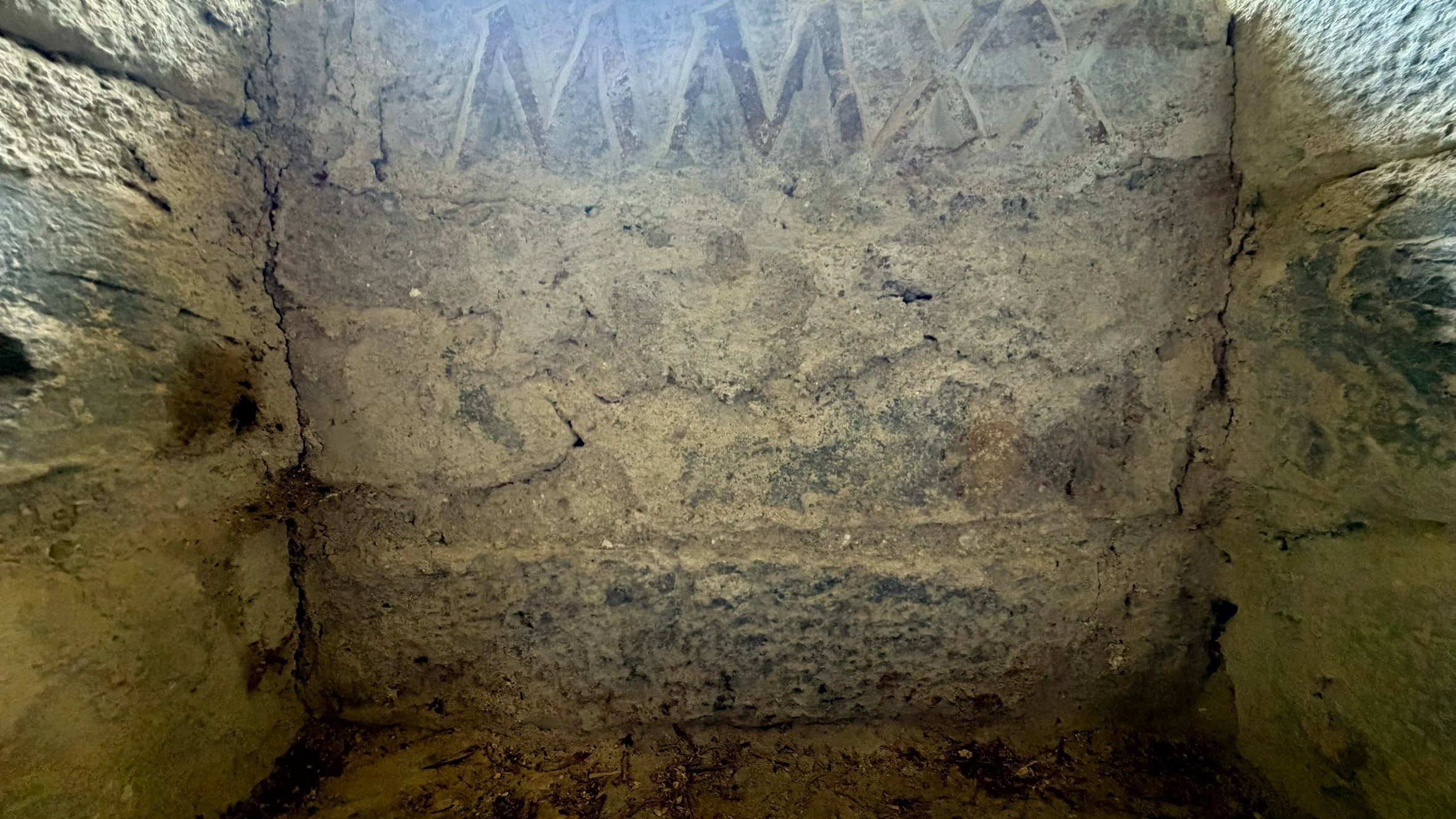 Wall recess below the biforate window bearing the inscription "2020".