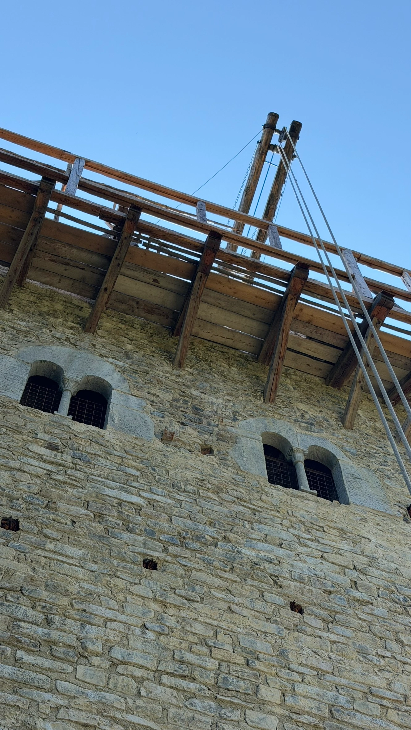 Biforate windows in the tower's west wall, viewed from outside.
