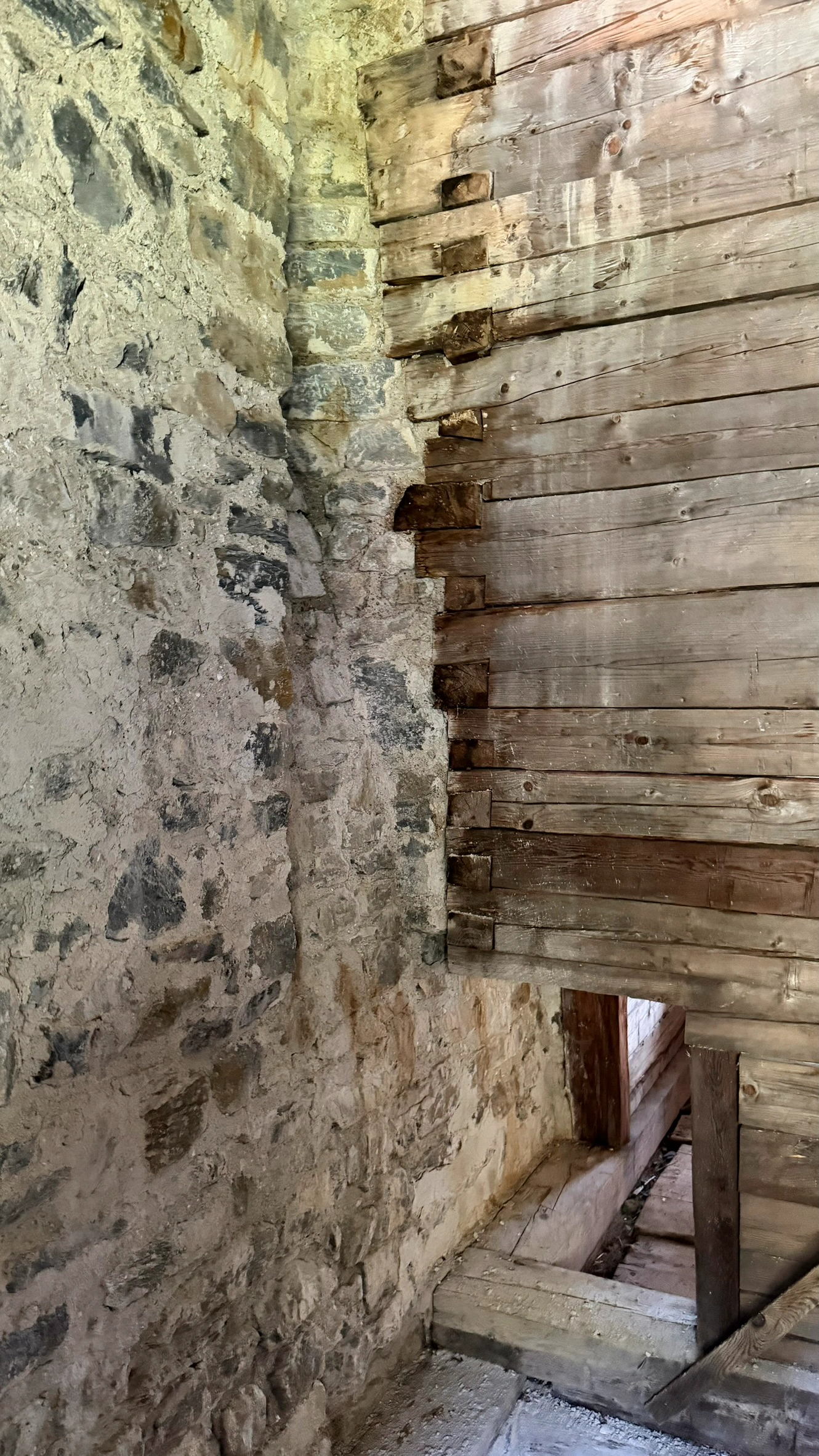 The opening below leads to the tiled stove in the winter room. Viewed from the summer room.