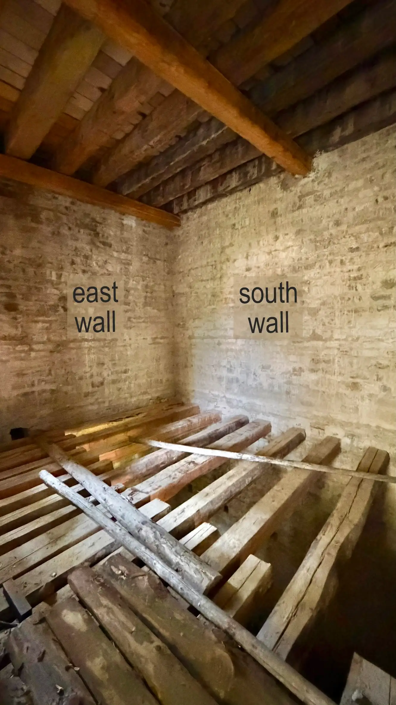 This image shows the main chamber on the entrance level. The ceiling joists and floorboards are visible.