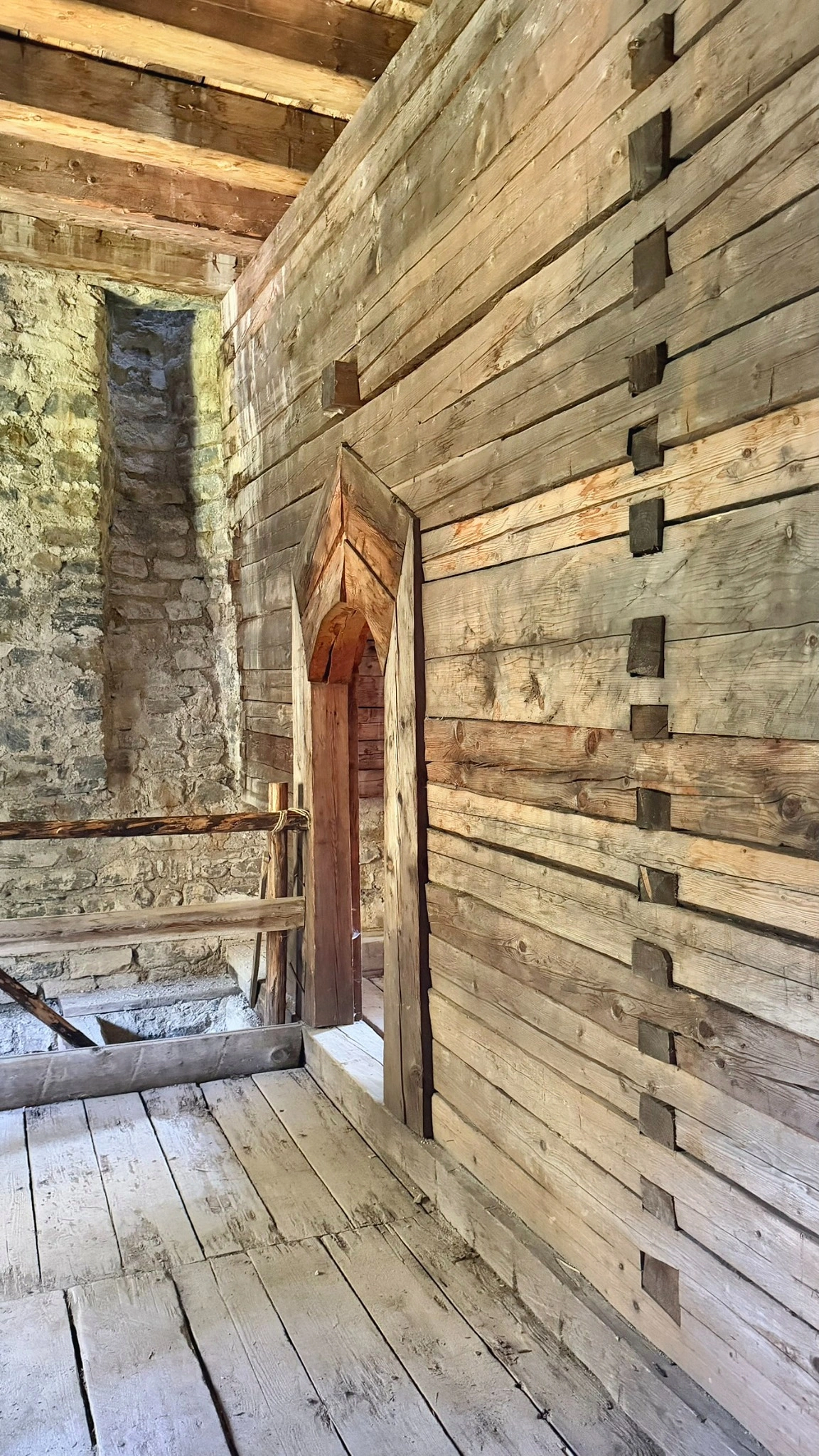 A timber block wall separates the summer room from the winter room and sleeping chamber.