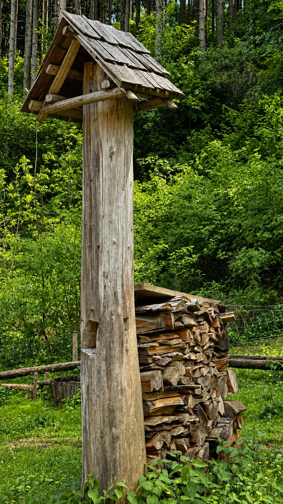 A small timber structure demonstrates the use of hand-split larch shingles.
