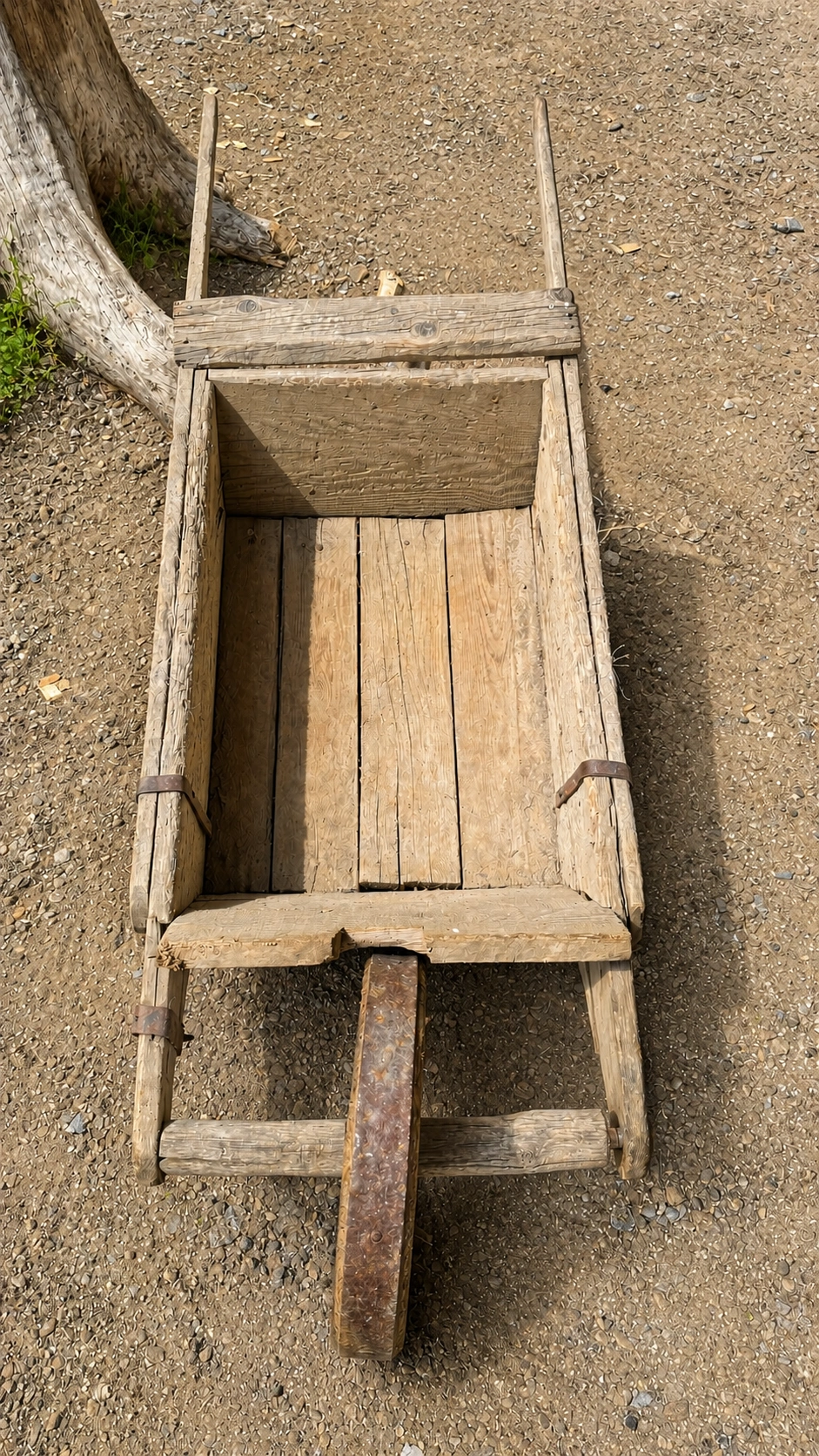 Wooden wheelbarrow for transporting building materials on site