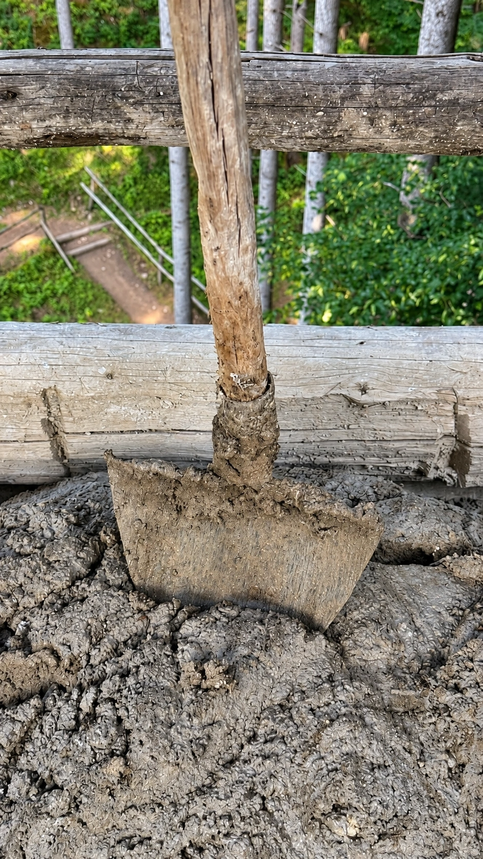 A mortar hoe blends lime and aggregate into workable mortar for masonry.
