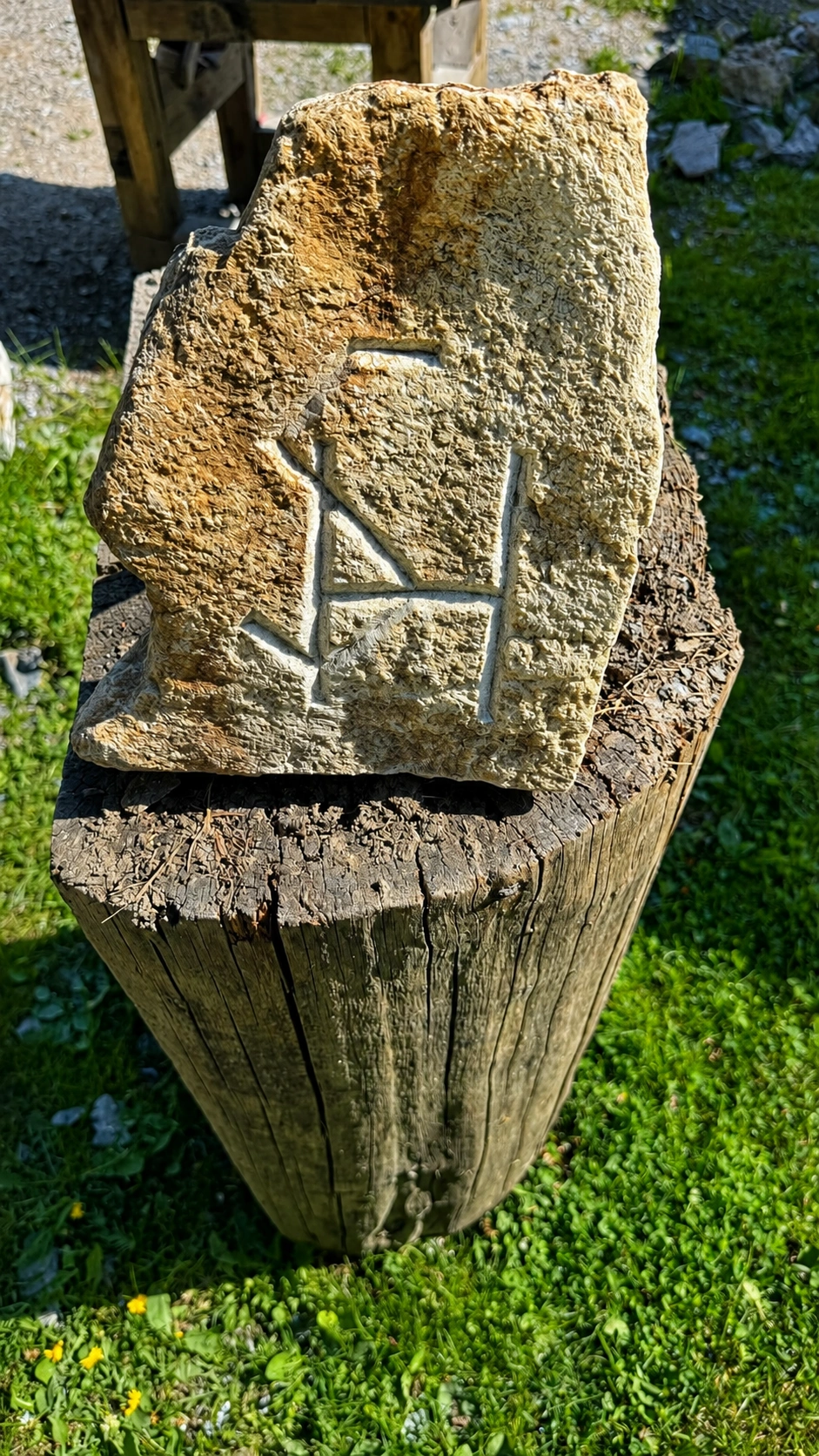Rough stone with carved grooves