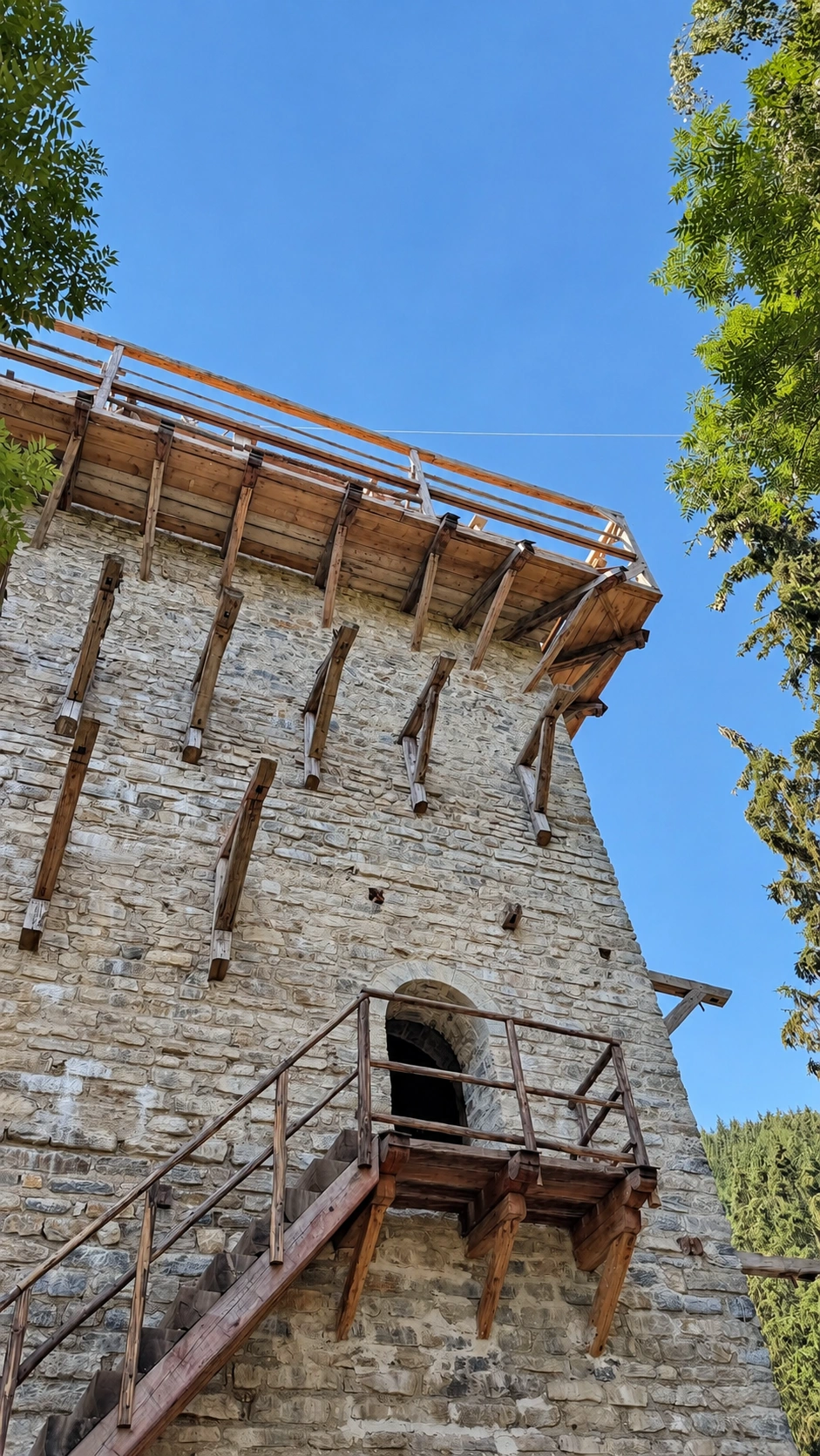 North-facing wall of the tower showing its raised entrance.