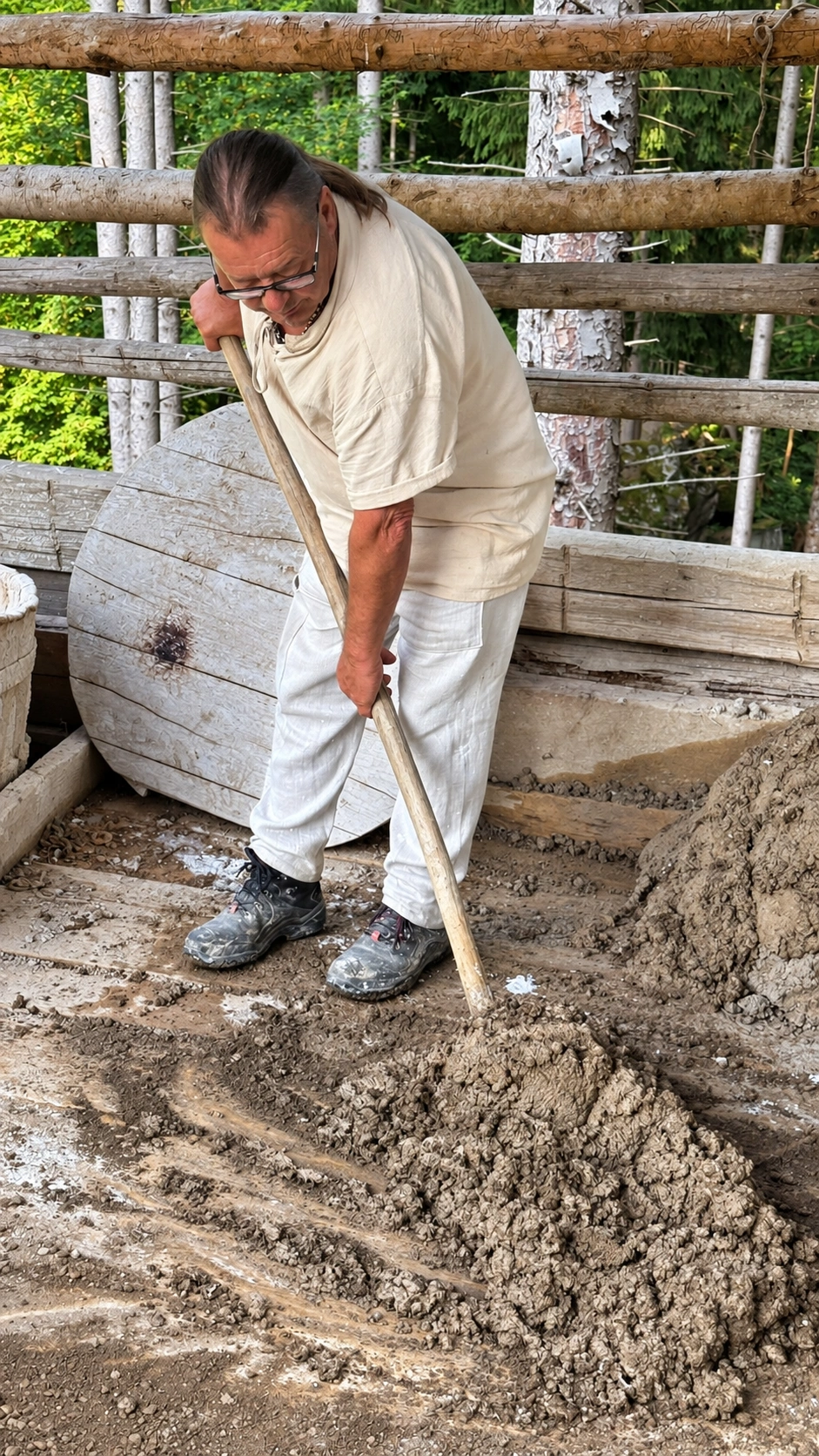 A mortar mixer uses a mortar hoe to prepare lime mortar.