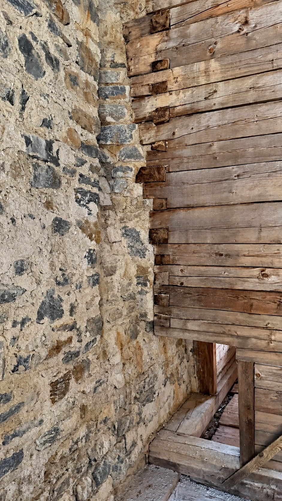 The opening below leads to the tiled stove in the winter room. Viewed from the summer room.