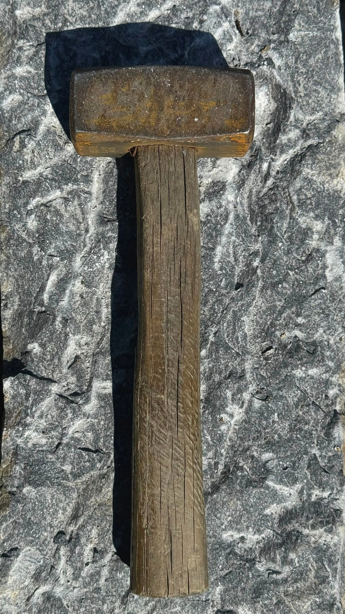 Mason’s hammer with wooden handle