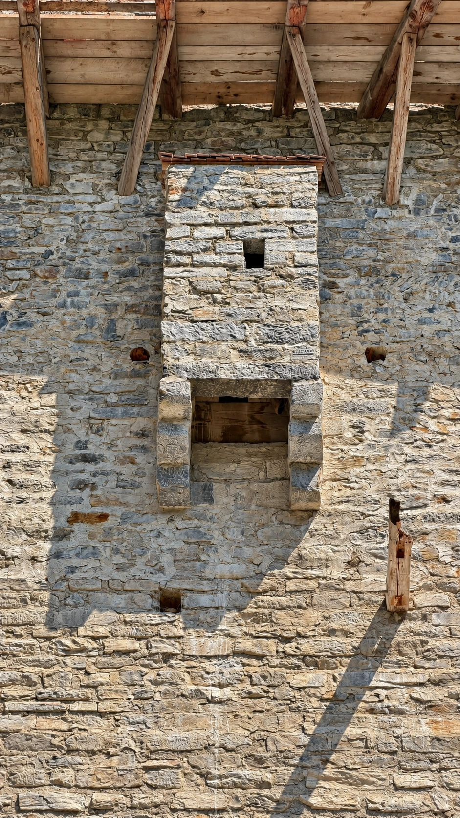 The garderobe projection on the tower's south wall, viewed from outside. It is connected to the sleeping chamber.