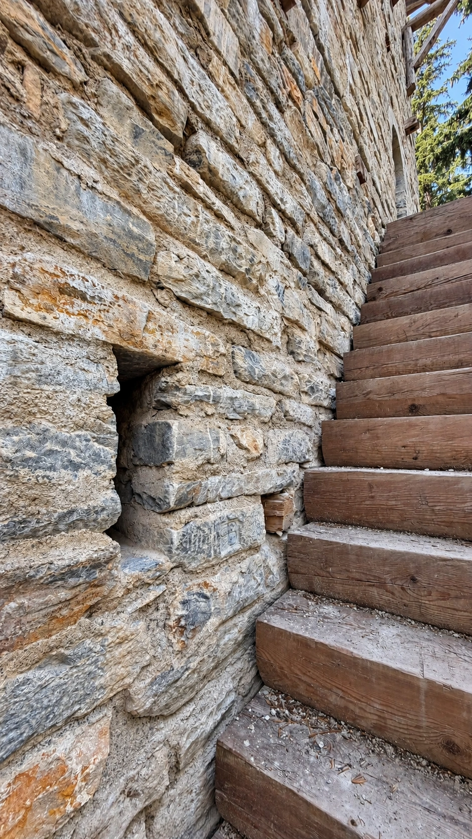 Rectangular opening for light and ventilation beside the entrance staircase.