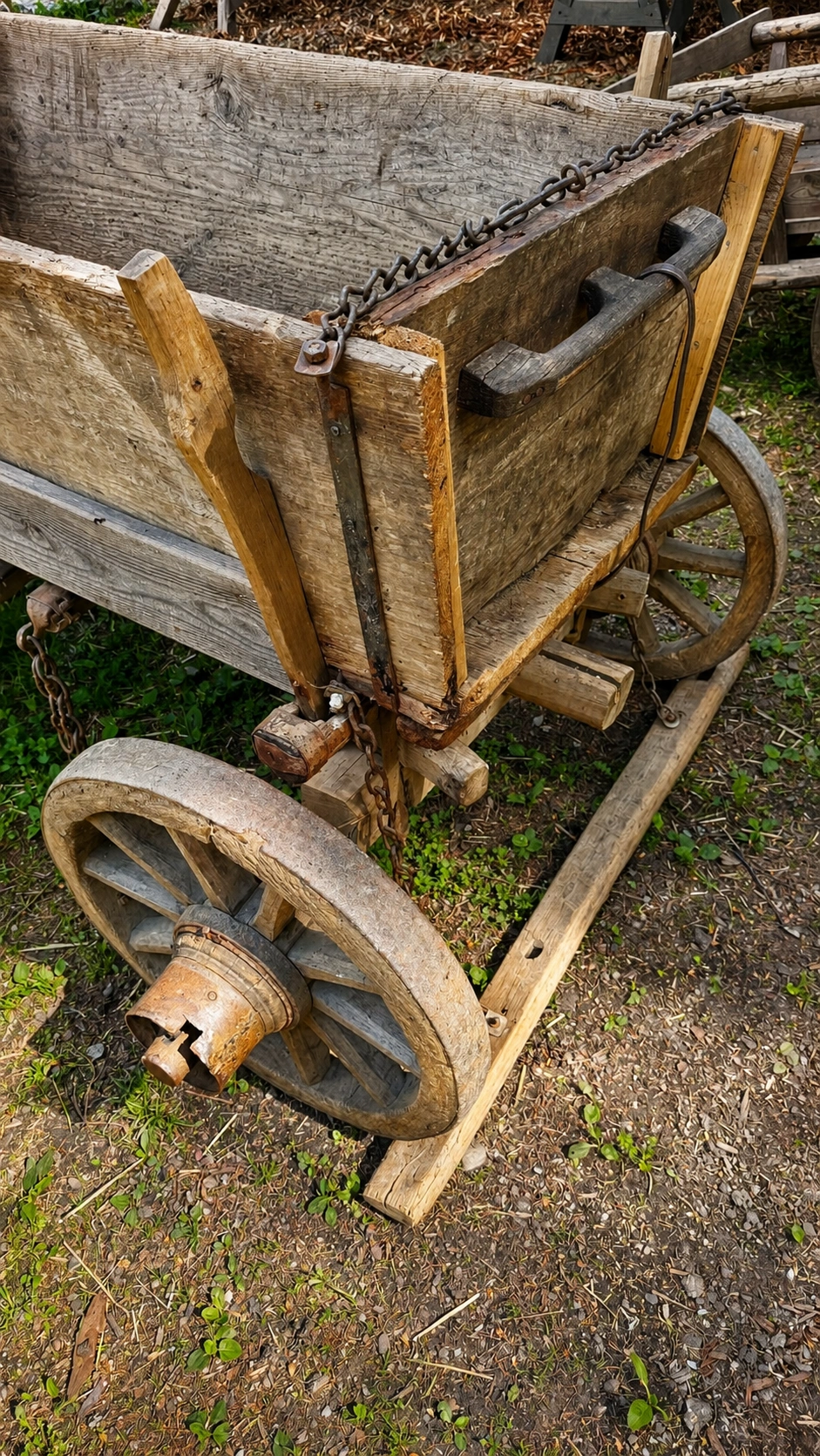 Iron fittings strengthen the tailgate and help secure heavy loads during transport.