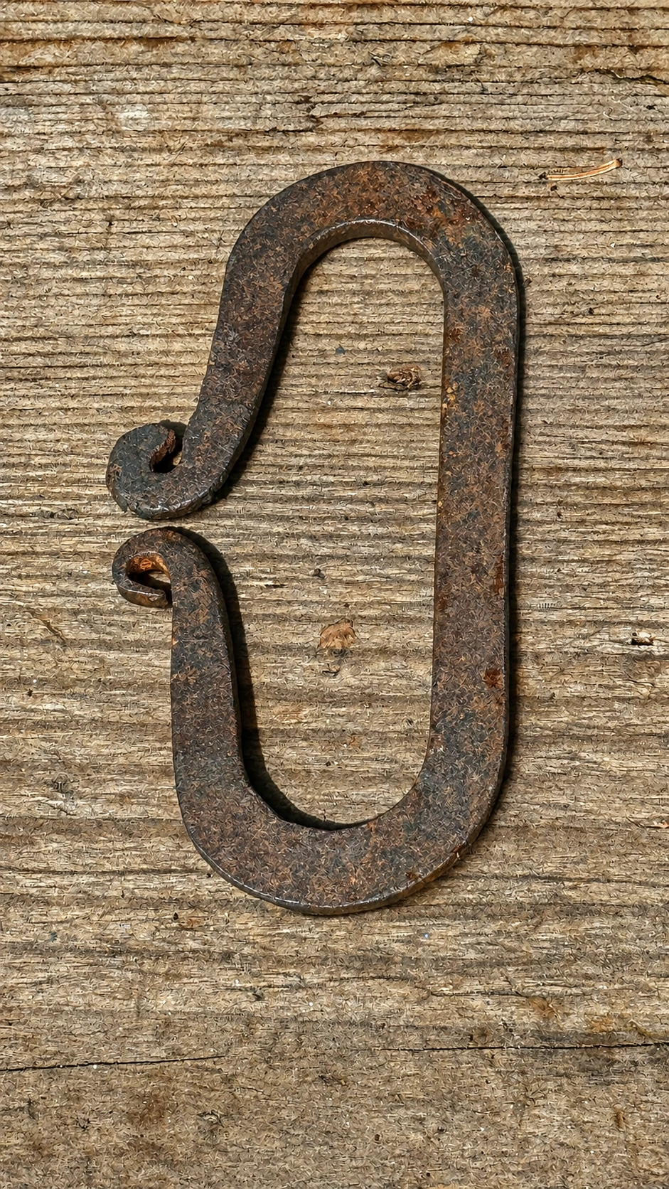 Simple iron hooks secure equipment, tools and supplies.