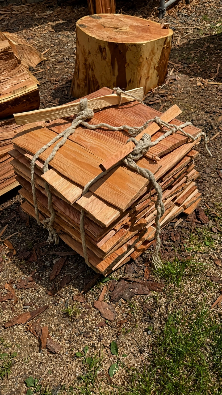 Bundles of shingles are tied for transport.